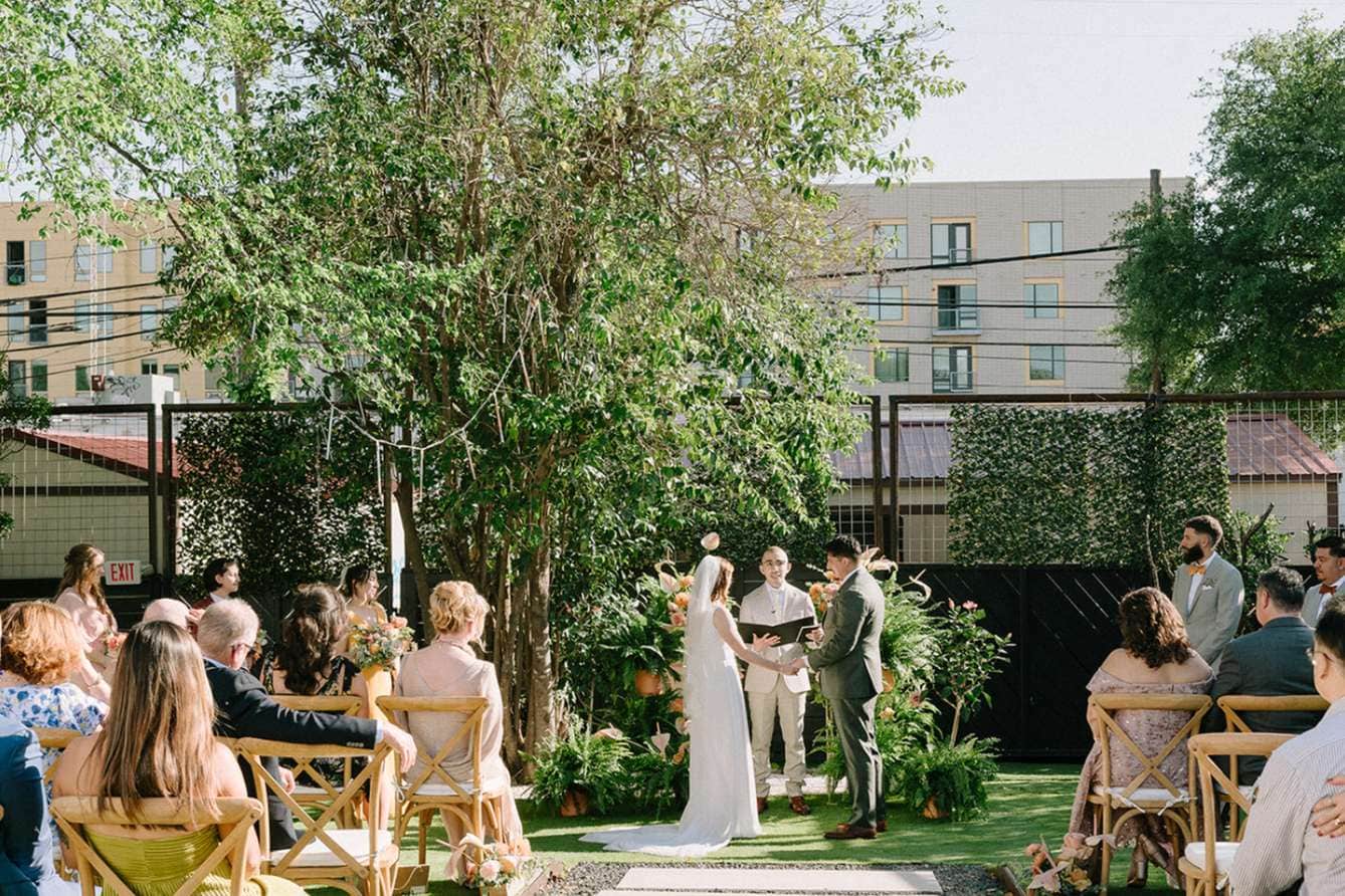 Outdoor urban garden wedding ceremony organized by Milwaukee event planners