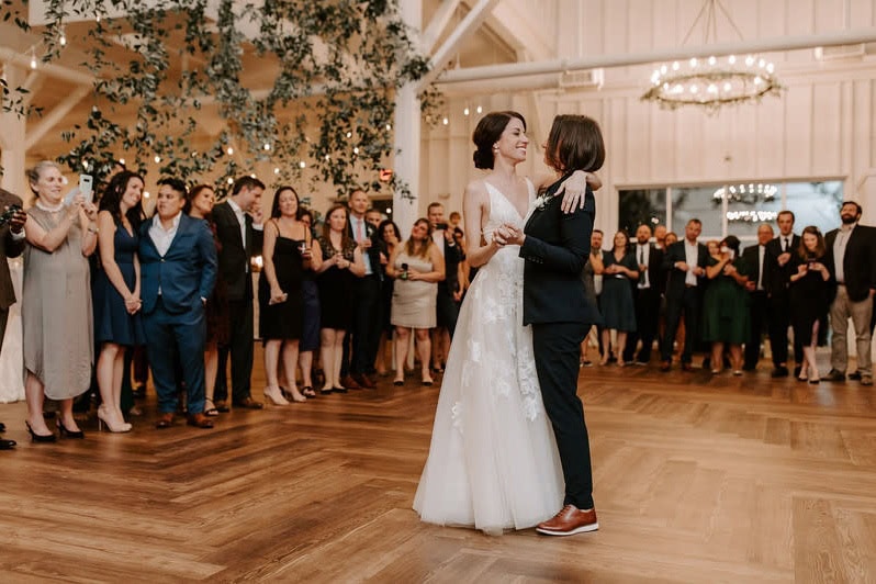 Two brides sharing first dance at Mississippi wedding reception