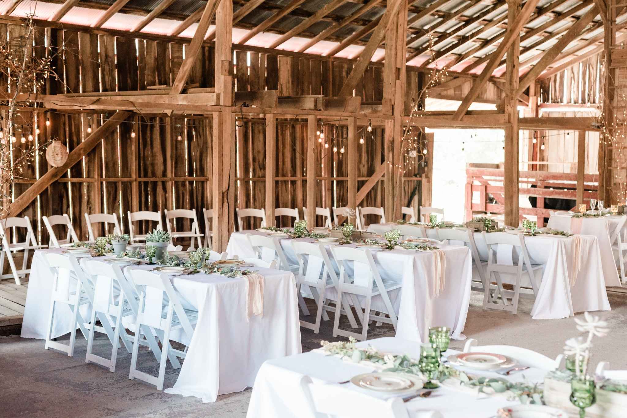 Rustic barn wedding venue styled with succulent centerpieces in Missouri