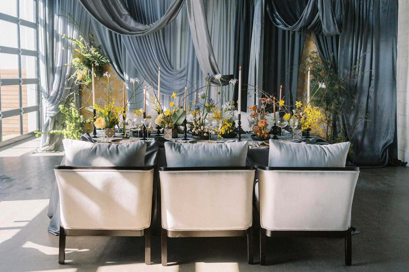 Styled Montana wedding reception table with drapery and florals