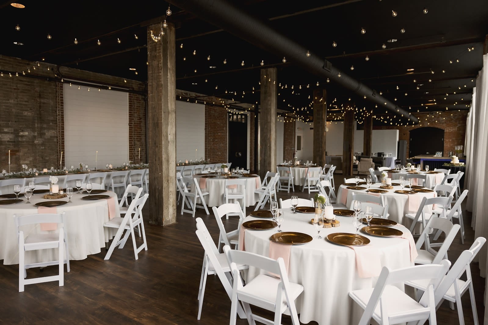 Ohio indoor wedding reception with banquet tables and string lights