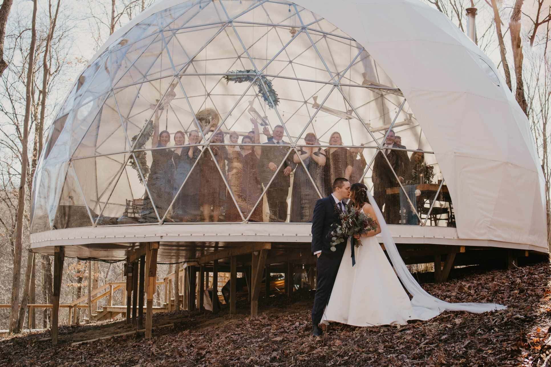 Bride and groom outside geodesic dome wedding venue in Ohio