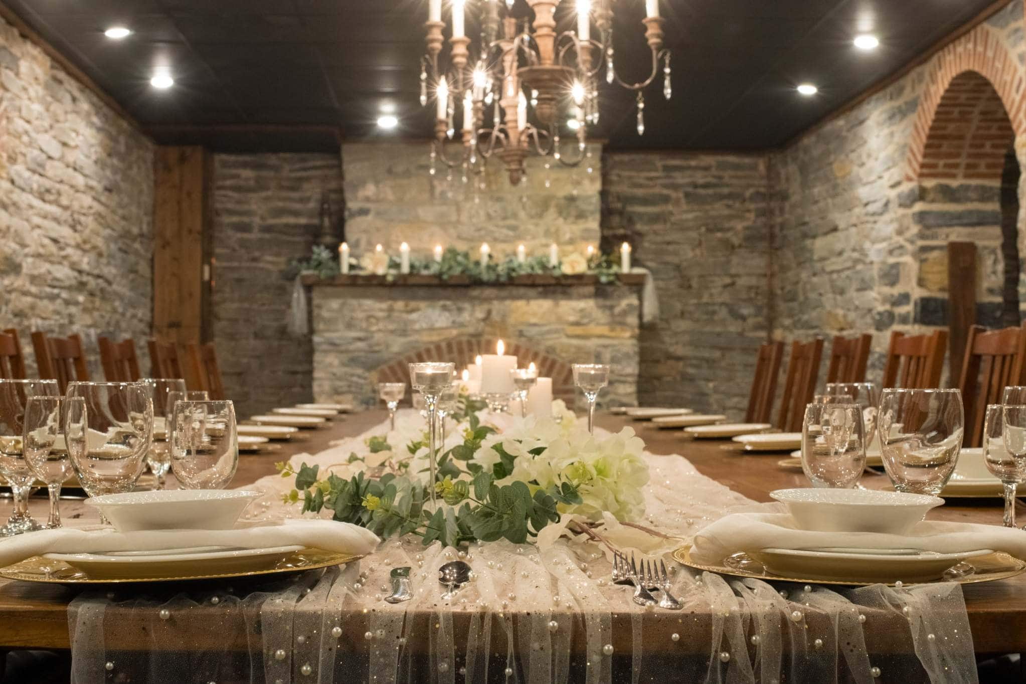 Elegant reception tablescape in a stone-walled Pennsylvania wedding venue