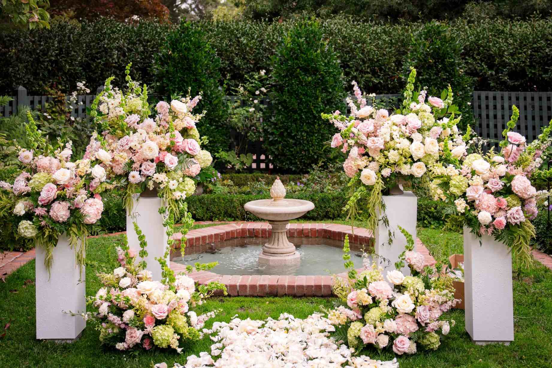 Manicured garden fountain with floral arrangements for San Jose weddings