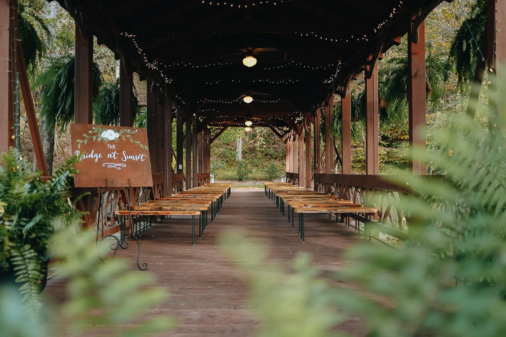 Covered outdoor corridor wedding reception venue in South Carolina with string lights