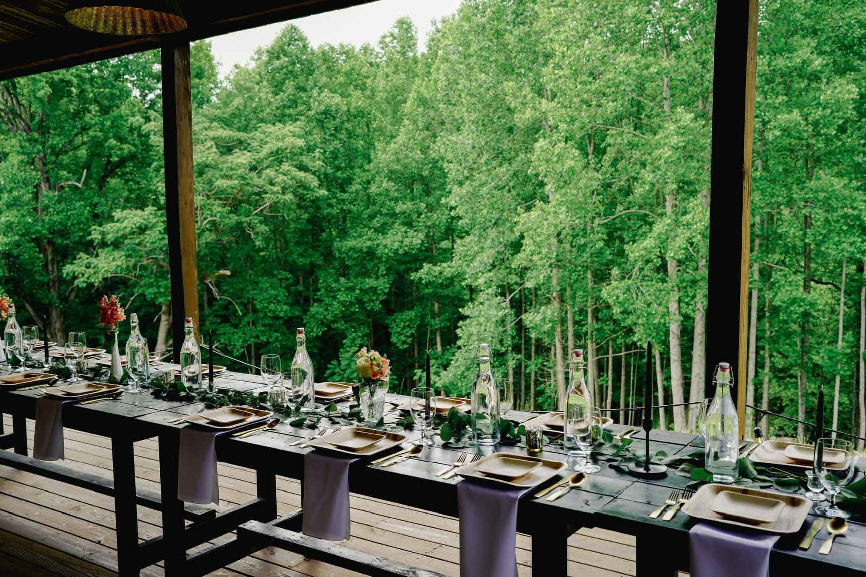 Elegant Tennessee wedding reception tablescape with florals and scenic backdrop