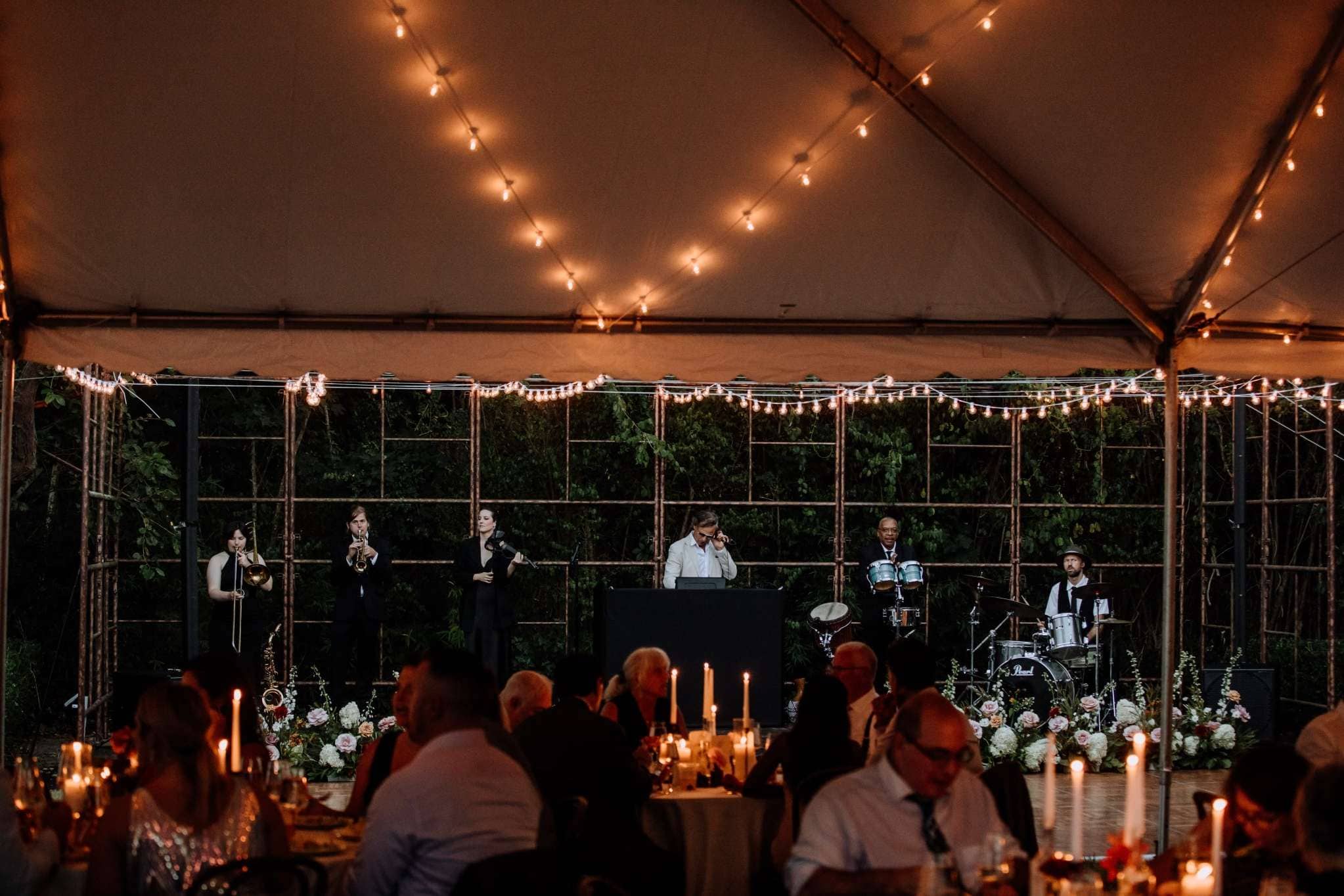Sophisticated indoor Texas wedding reception featuring a live jazz band and candlelit tables