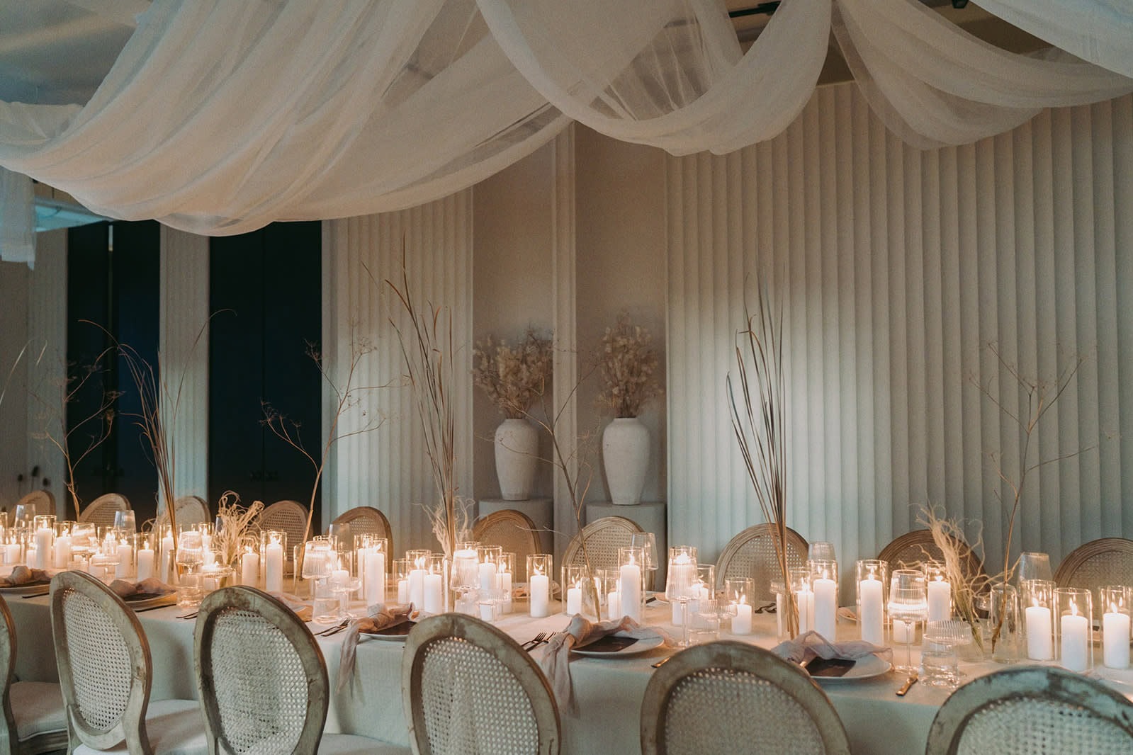 Elegant Toledo wedding reception table with candles, draping, and dried floral styling