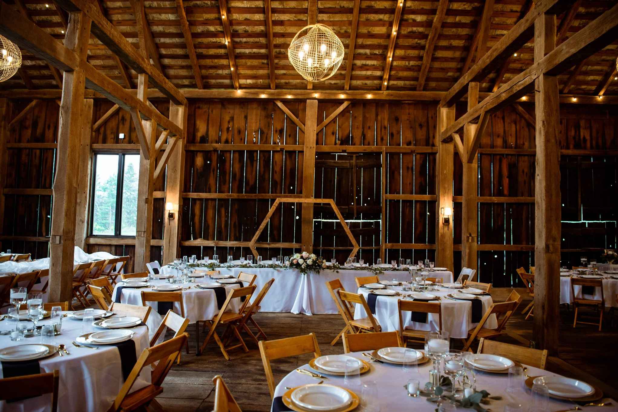 Rustic barn wedding venue in Wisconsin with elegant white decor