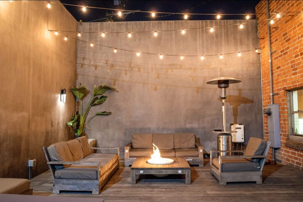 Industrial rooftop space with heaters and fire pits