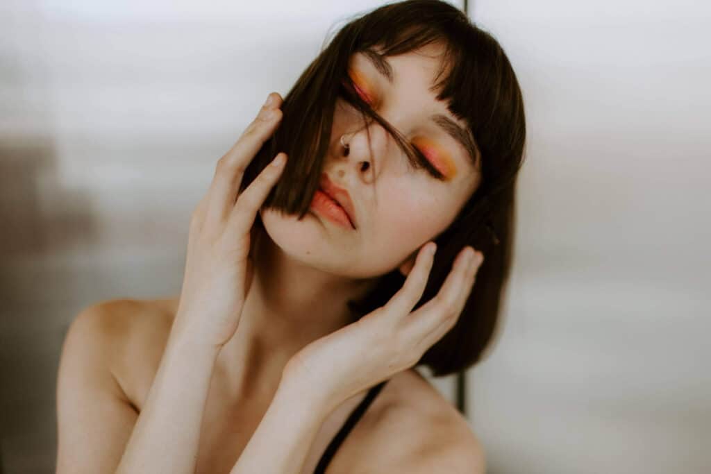 a woman's fashion pose headshot