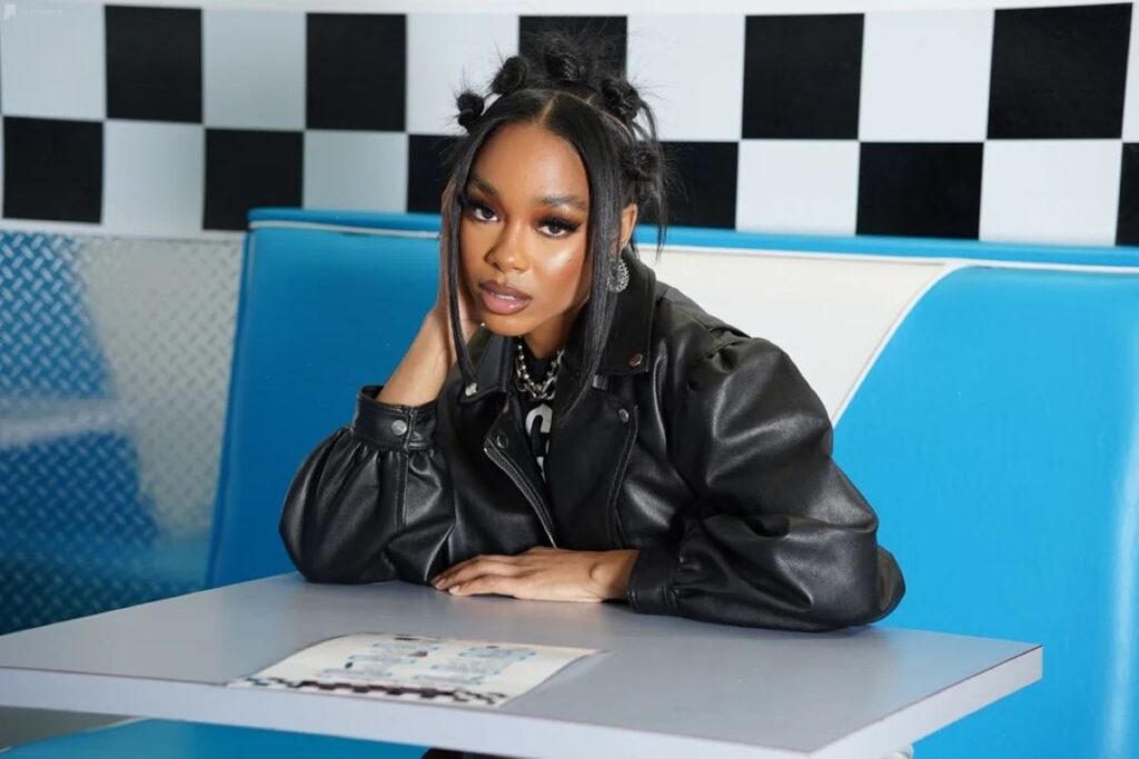 a woman's portrait in a diner setting