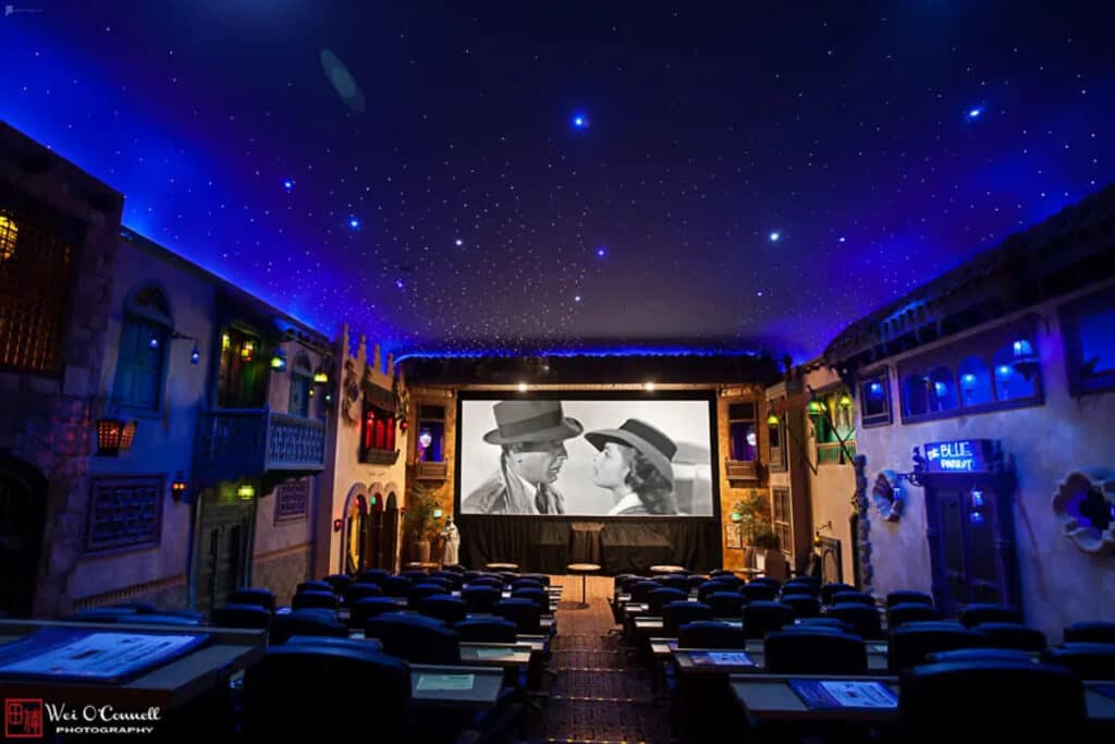 a themed movie theater with starry ceiling