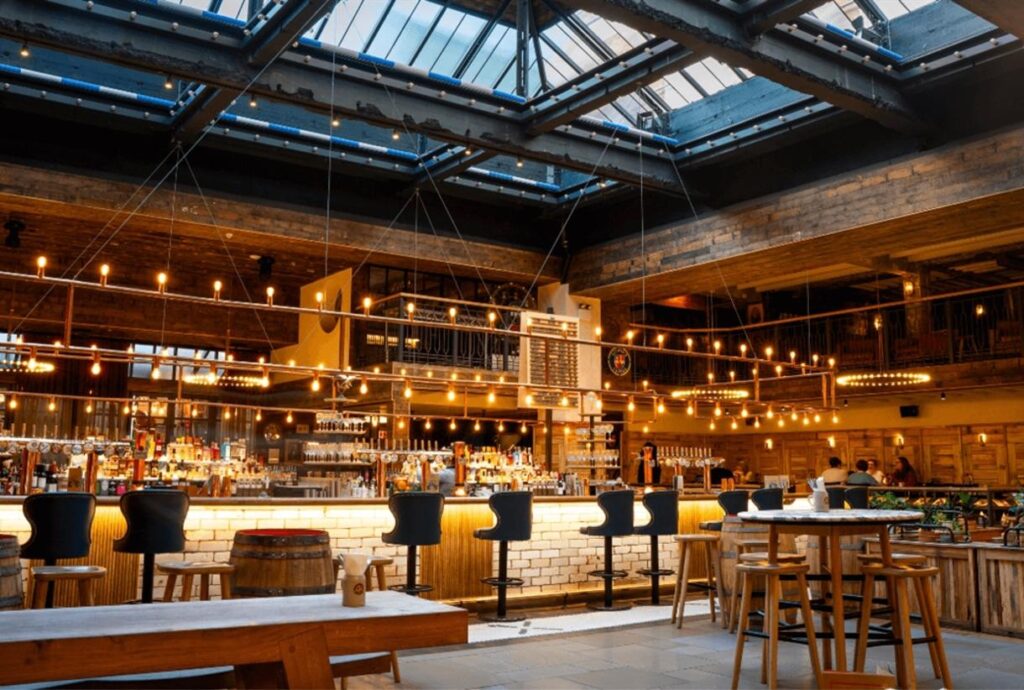 Glass-roofed atrium and bar at Albert's Schloss in central Manchester