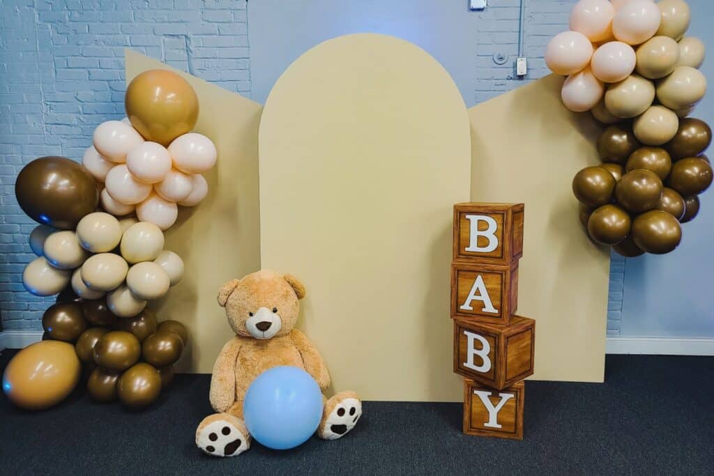 gender reveal display with large teddy bear