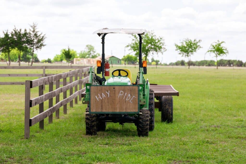 small tractor with hay ride sign