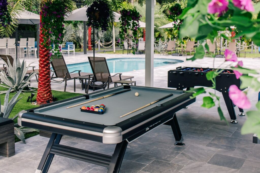 pool table by a swimming pool