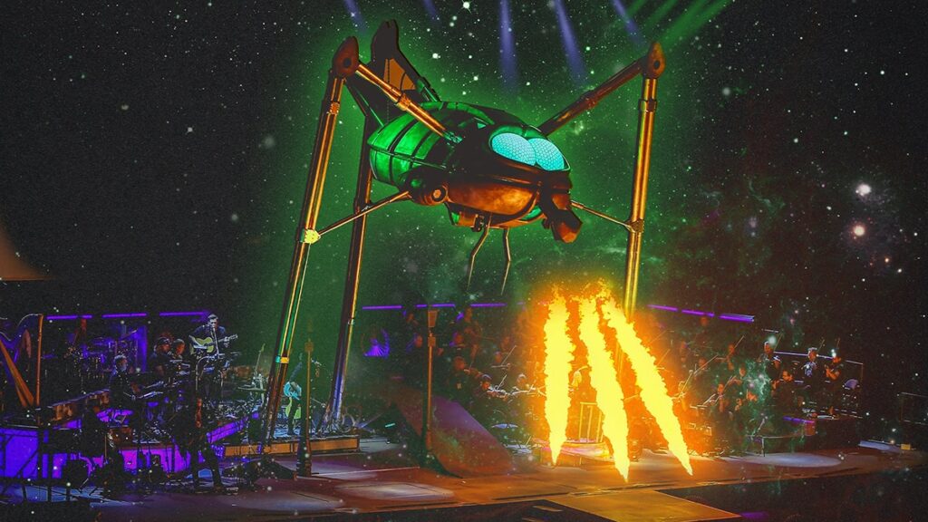 Jeff Wayne War of the Worlds London concert with giant Martian tripod over orchestra and pyrotechnics on stage