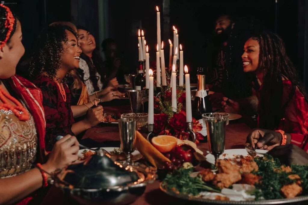 A group of friends having a candlelight dinner together.
