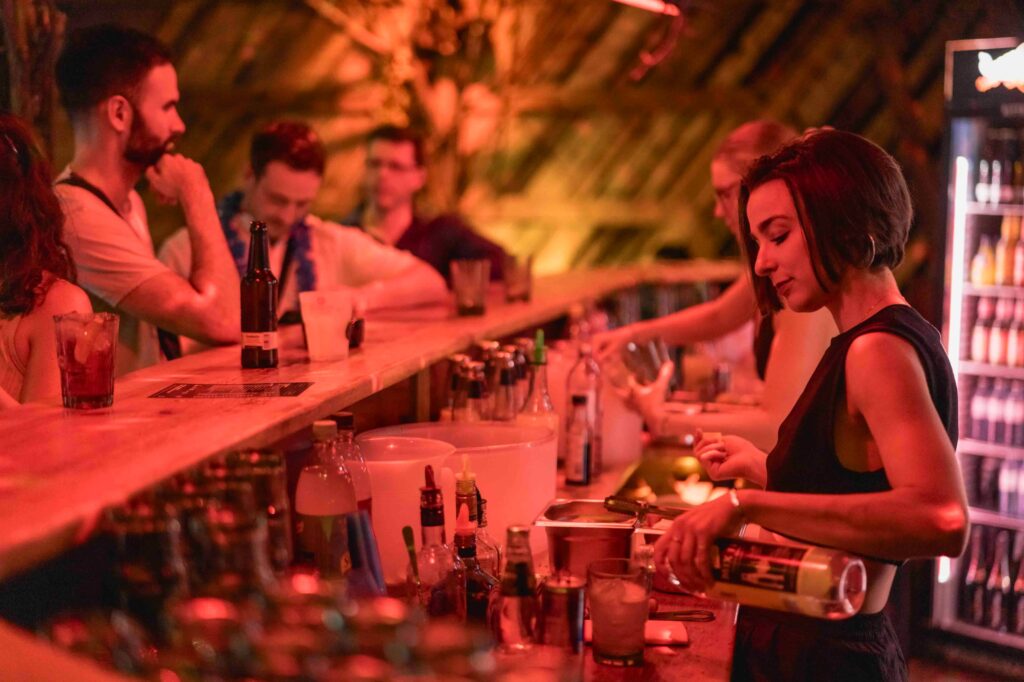 Female bartenders making drinks for guests of an event in London with minimum spend