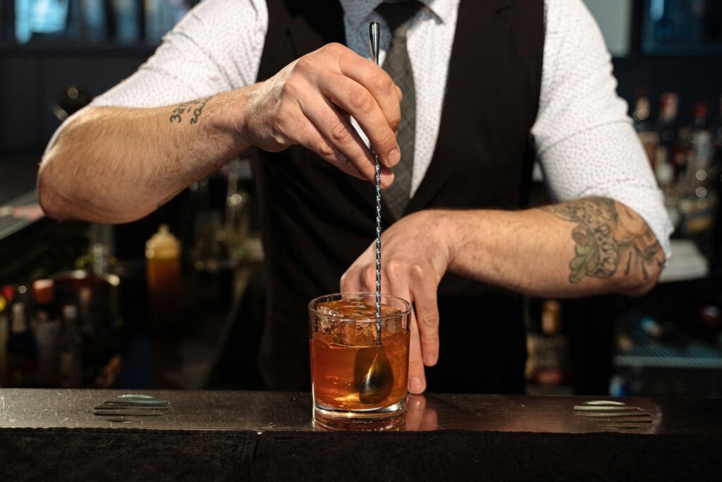 barman mixing a cocktail