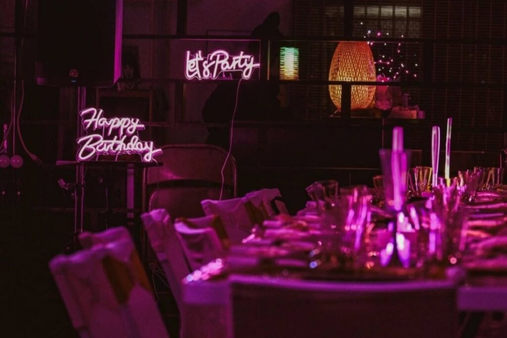 neon lights around a pink tablescape