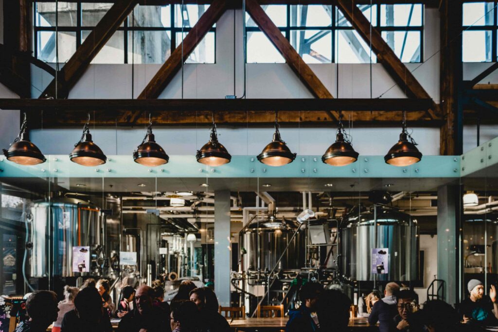 A large brewery or distillery hosting guests for a tasting.