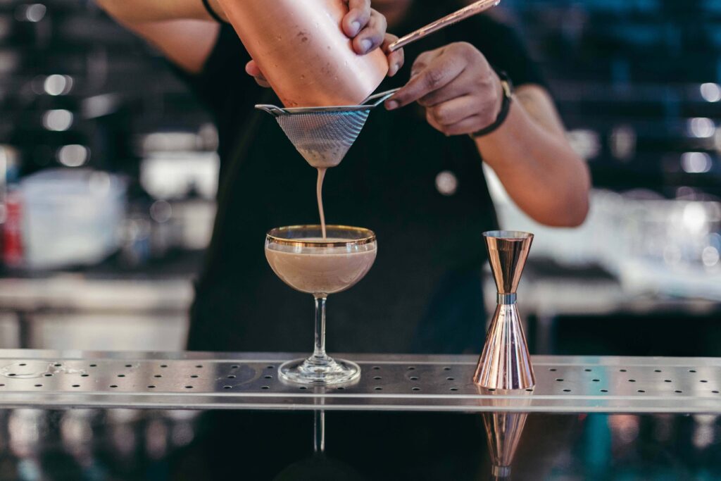 Bartender making a cocktail at a bar