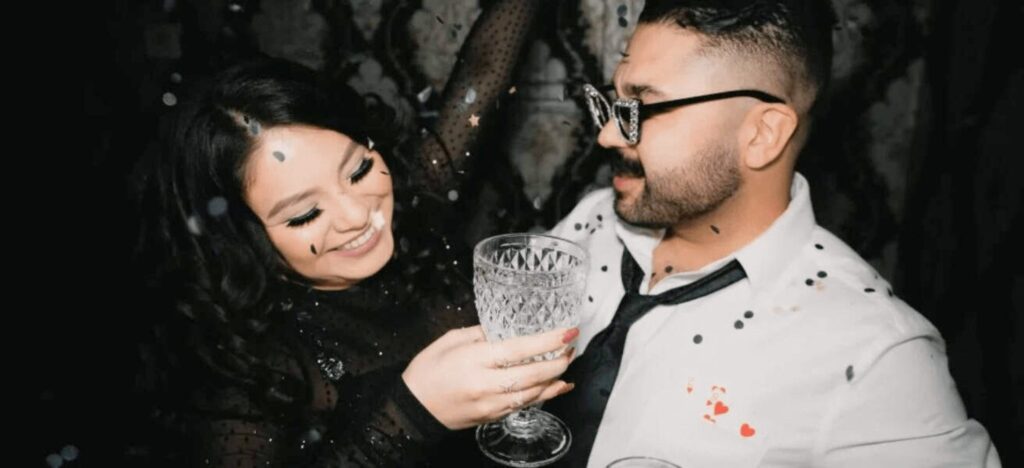 couple celebrating as confetti falls over them