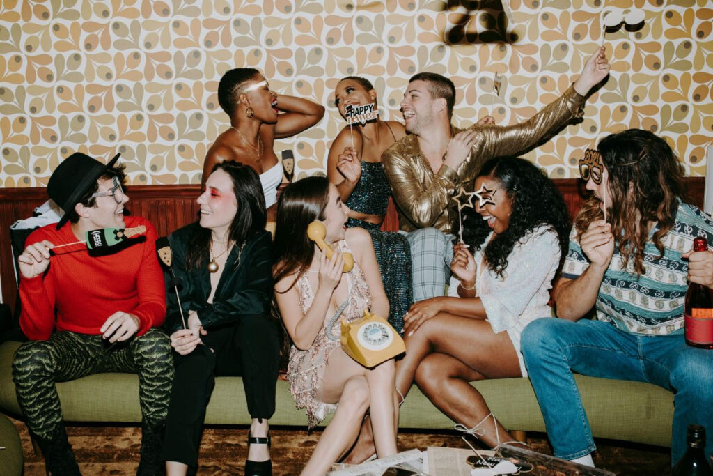 A group of friends having a retro-themed party.