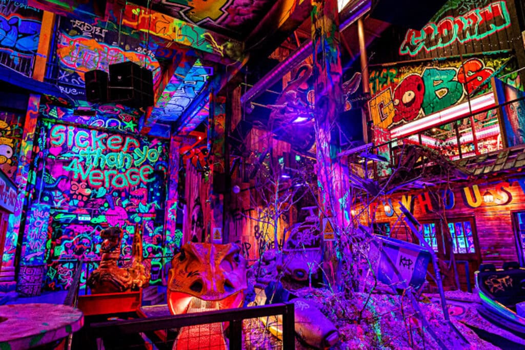 Graffiti covered indoor crazy golf course and bar in Liverpool