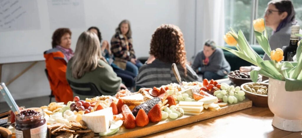 cheese and fruit platter on a table at a gathering