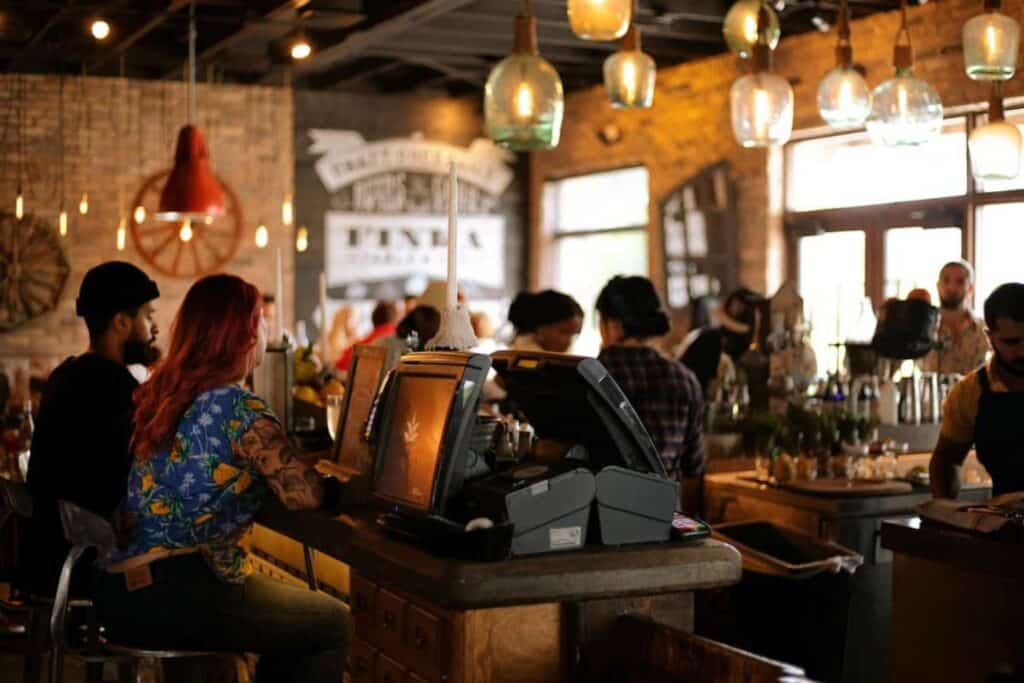 rustic cafe scene with patrons sat at the counter