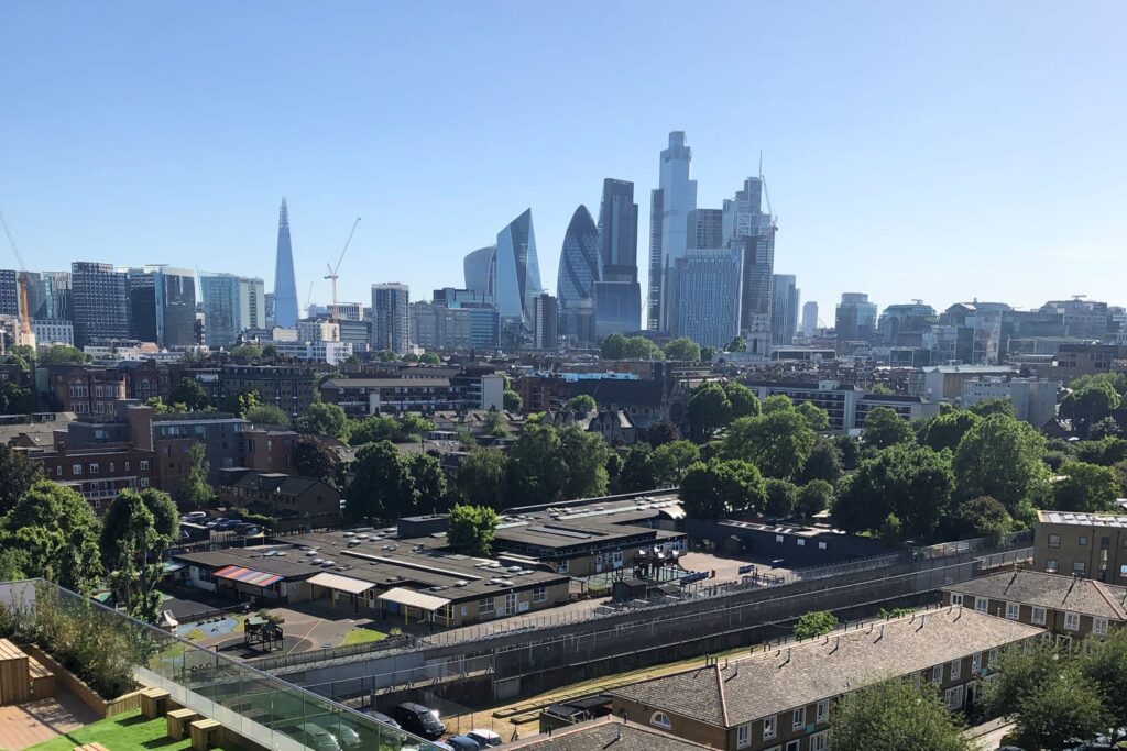 View of London's skyline on a sunny day from a penthouse.