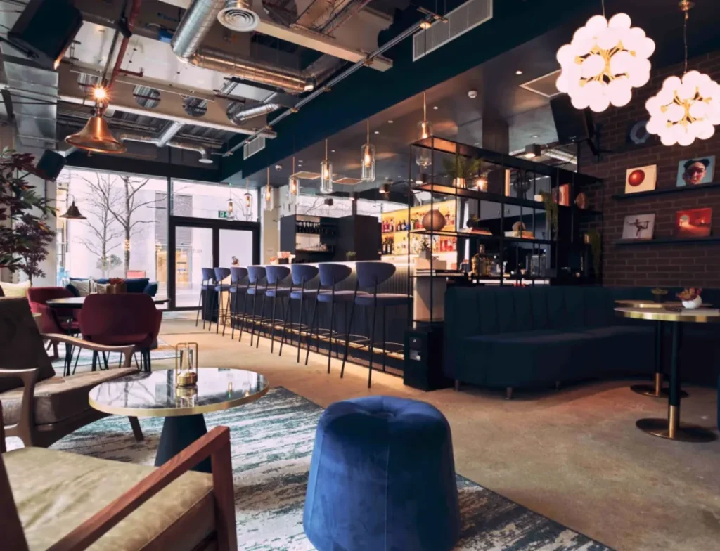 Upscale bar in Canary Wharf, London with velvet furniture
