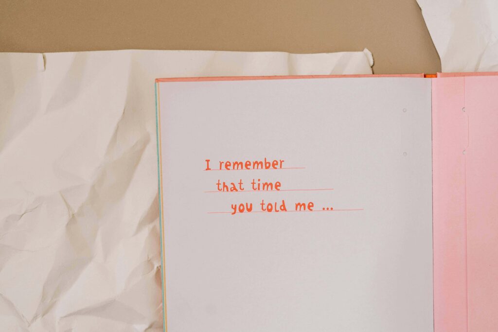 View of an open notebook to record memories of someone that says " I remember that time you told me...."