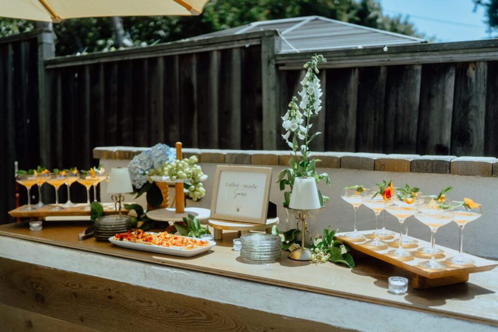 outdoor tablescape with drinks and nibbles