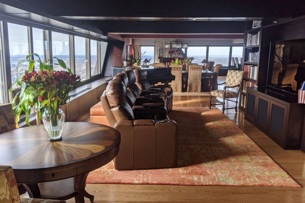 A vintage-style penthouse with views of the surrounding area from large wrap-around windows.