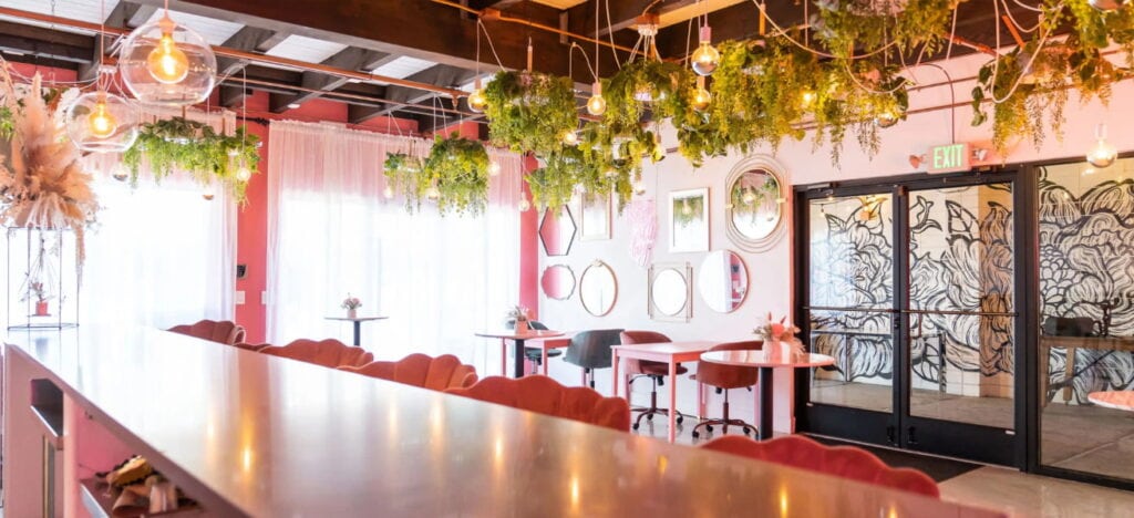 pink coloured bar with greenery accents