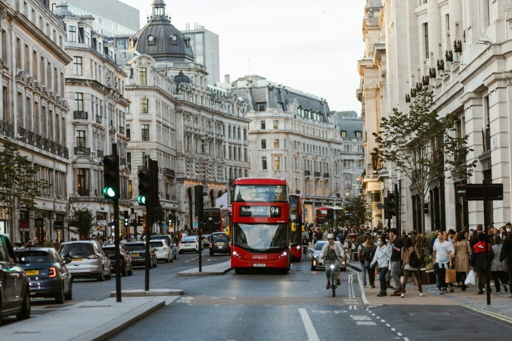 Red double-decker bus on a busy London street