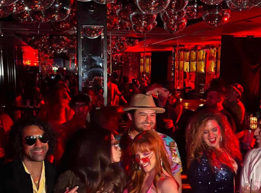 retro disco with partygoers dressed in retro outfits