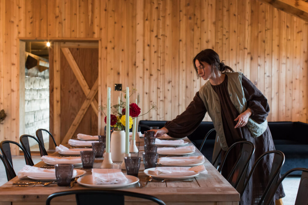 a small event reception with someone setting the table
