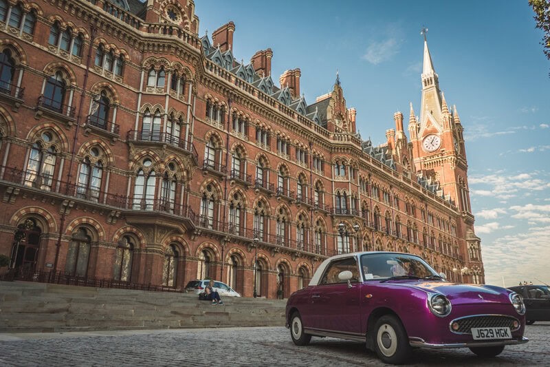 Gothic Revival facade and clock tower of St Pancras Chambers seen from the forecourt.
