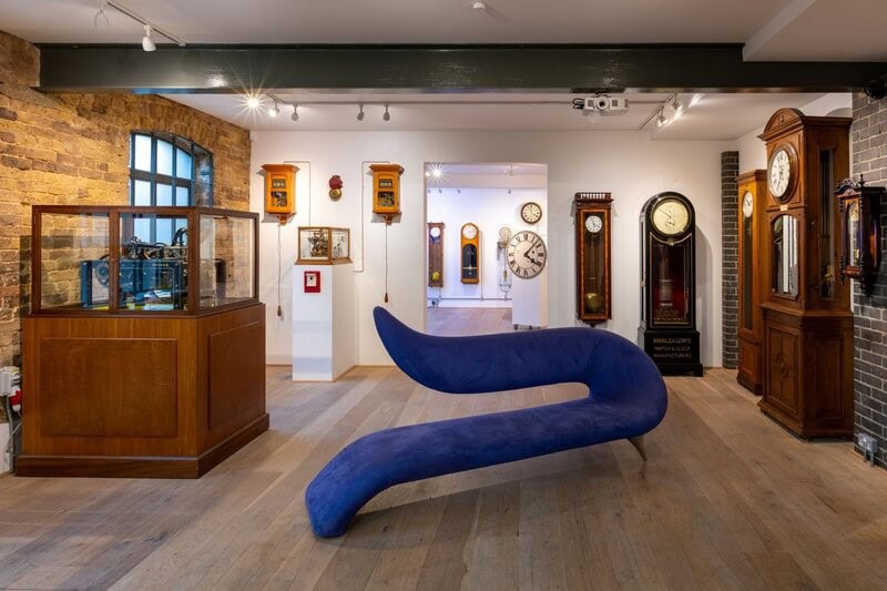 Electrical clocks displayed in the main gallery of The Clockworks museum in West Norwood.