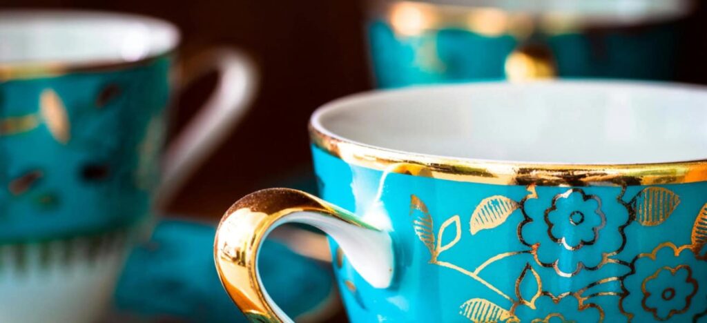 china cups with a blue and gold design 