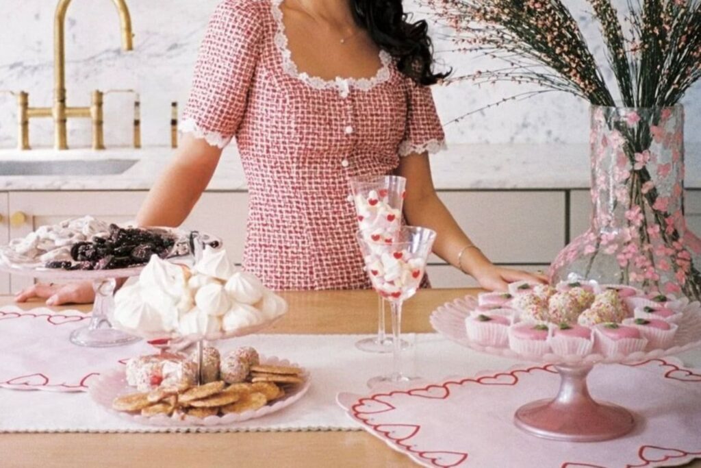 sweat treats on a table with someone standing behind