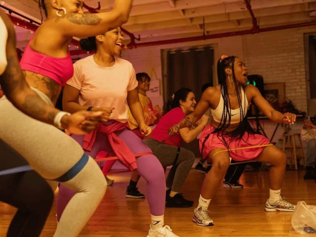 Women taking a dance class at a dance studio.